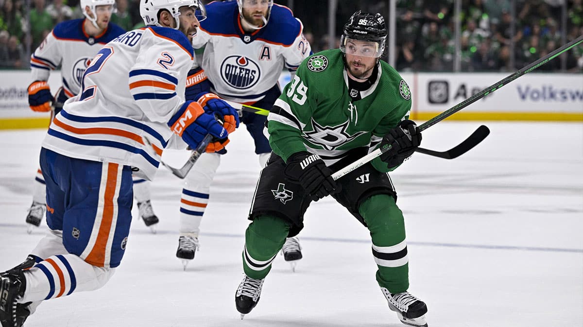 Edmonton Oilers defenseman Evan Bouchard (2) and Dallas Stars center Matt Duchene (95) in action during the game between the Dallas Stars and the Edmonton Oilers in game two of the Western Conference Final of the 2024 Stanley Cup Playoffs at American Airlines Center.