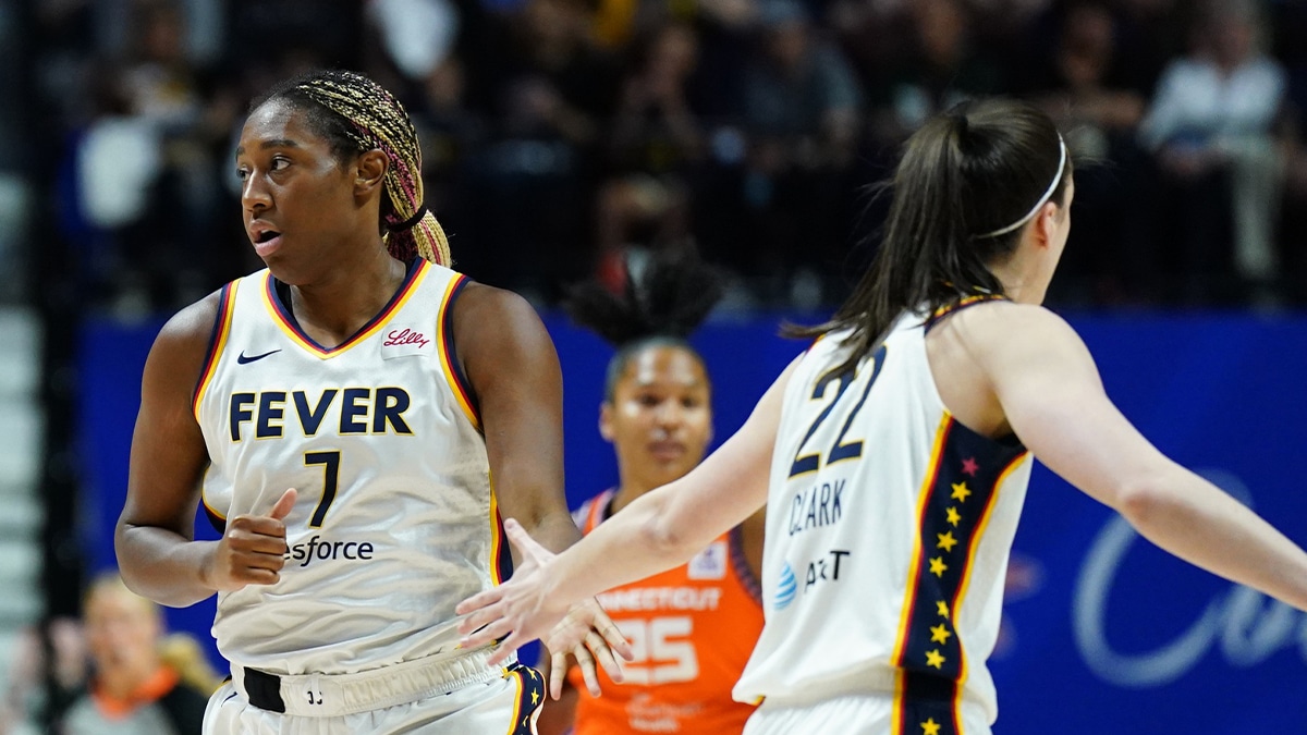 Indiana Fever forward Aliyah Boston (7) and guard Caitlin Clark (22) react after a basket against the Connecticut Sun