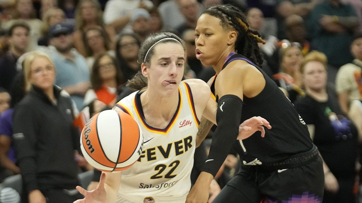  Indiana Fever guard Caitlin Clark (22) is fouled by Phoenix Mercury guard Sug Sutton (1) during the fourth quarter at Footprint Center.