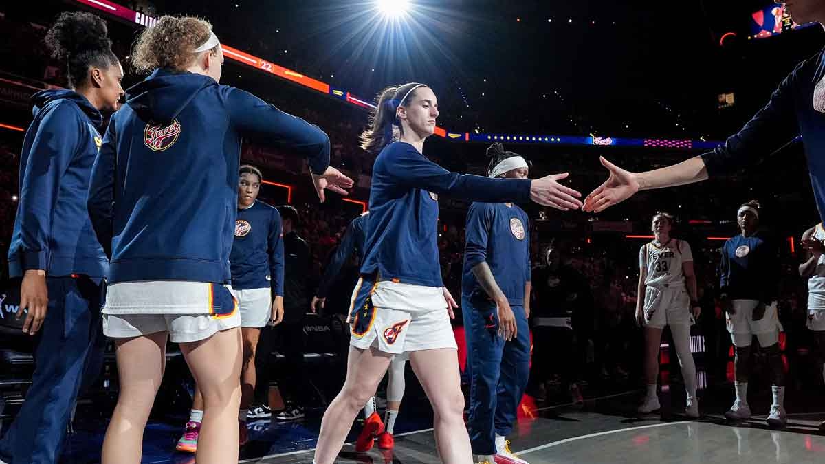 Indiana Fever guard Caitlin Clark (22) shakes hands with Indiana Fever guard Lexie Hull (10)