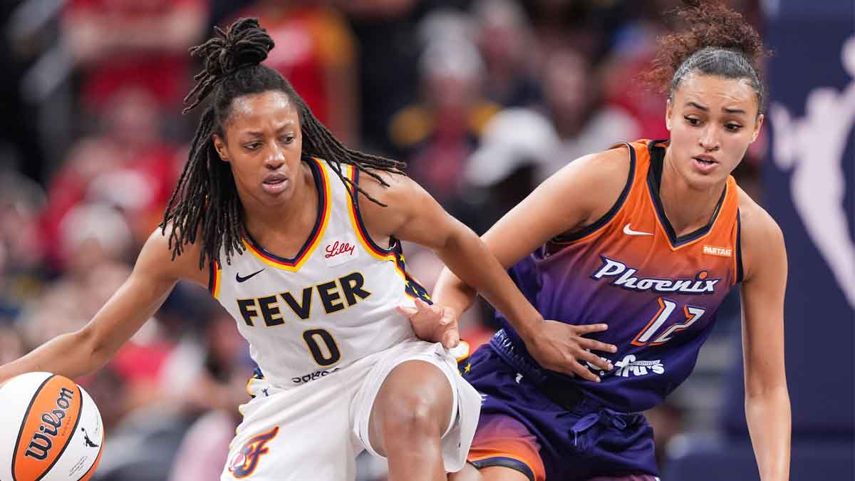 Indiana Fever guard Kelsey Mitchell (0) rushes up the court against Phoenix Mercury Celeste Taylor (12) on Friday, July 12,