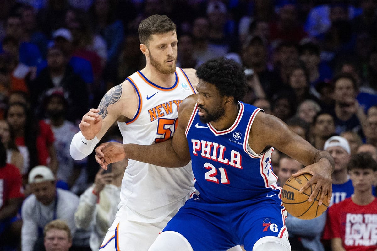 Philadelphia 76ers center Joel Embiid (21) controls the ball against New York Knicks center Isaiah Hartenstein (55) during the first half of game six of the first round for the 2024 NBA playoffs at Wells Fargo Center.