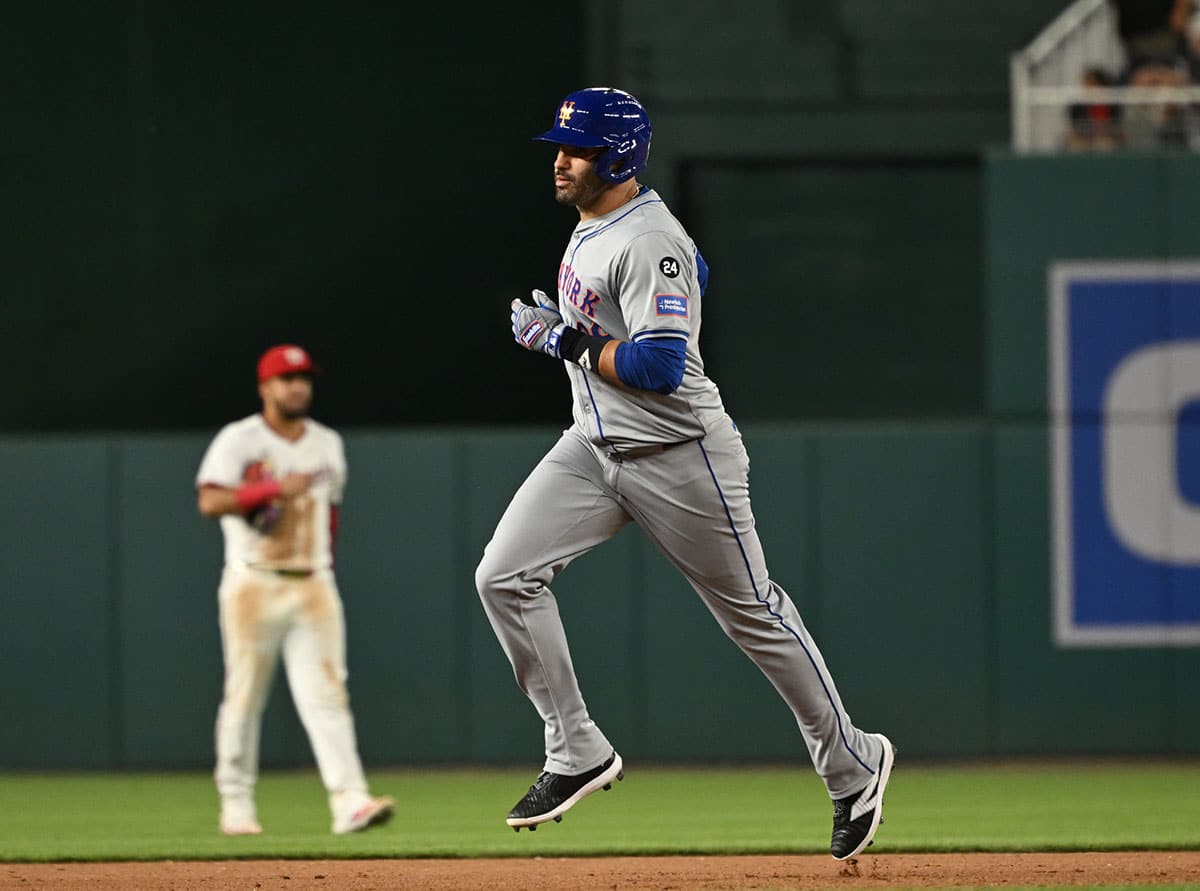New York Mets designated hitter J.D. Martinez (28) rounds the bases after hitting a three run home run against the Washington Nationals during the tenth inning at Nationals Park.