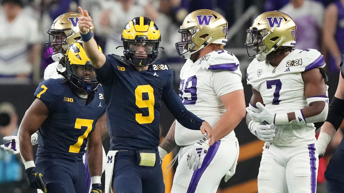 Michigan quarterback J.J. McCarthy points down the field during the second half of the College Football Playoff national championship game against Washington