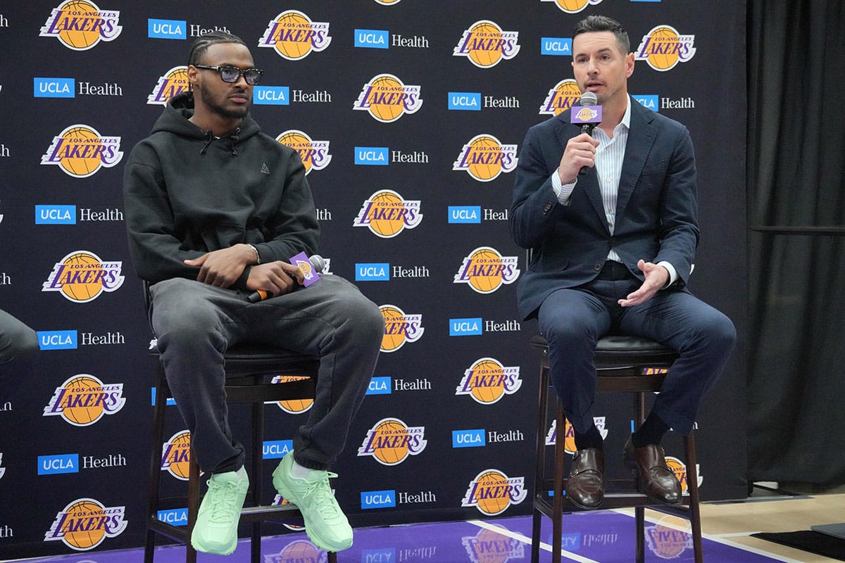 Los Angeles Lakers coach JJ Redick (right) and second-round draft pick Bronny James at a press conference at the UCLA Health Training Center. 