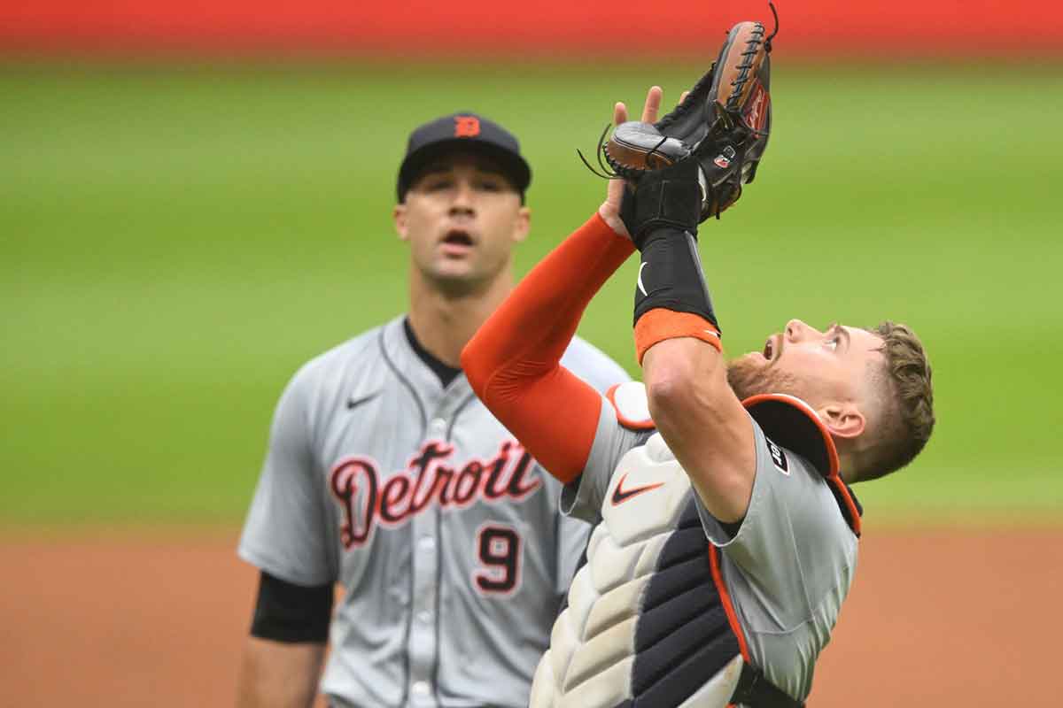 Detroit Tigers catcher Carson Kelly (15) looks for a foul ball beside starting pitcher Jack Flaherty (9) in the first inning against the Cleveland Guardians at Progressive Field.