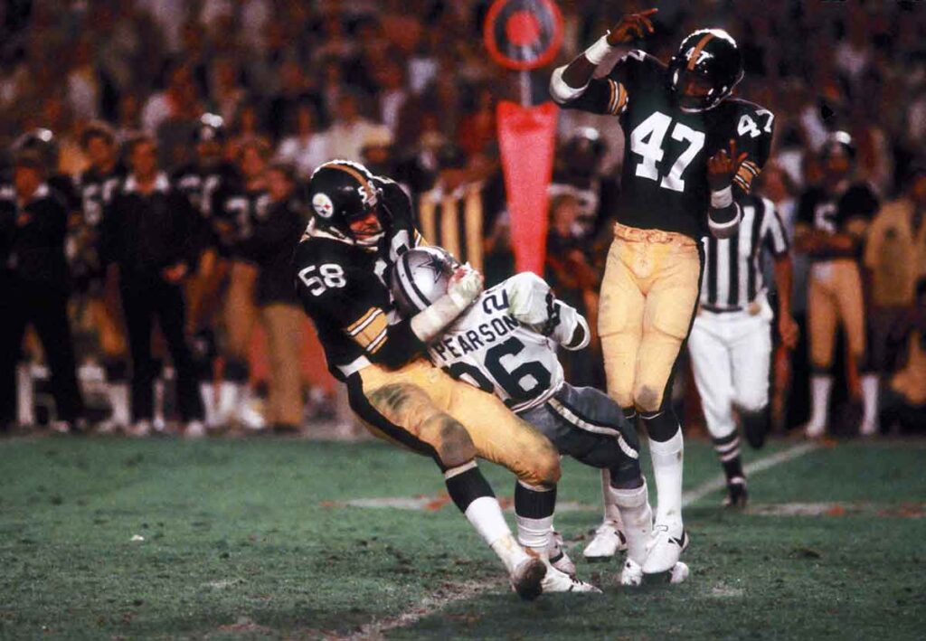 Pittsburgh Steelers linebacker #58 Jack Lambert tackles Dallas Cowboys running back #26 Preston Pearson during Super Bowl XIII at the Orange Bowl. The Steelers defeated the Cowboys 35-31.