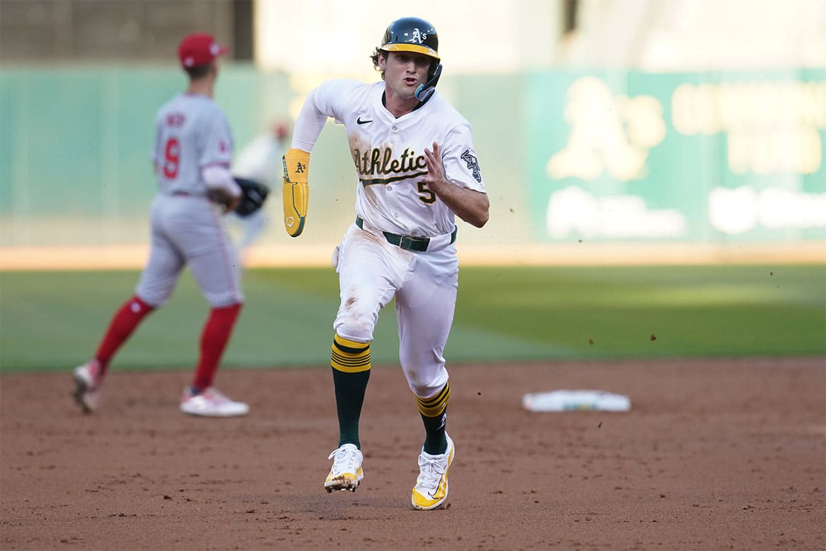  Oakland Athletics shortstop Jacob Wilson (5) runs towards third base before scoring a run against the Los Angeles Angels in the third inning at Oakland-Alameda County Coliseum.