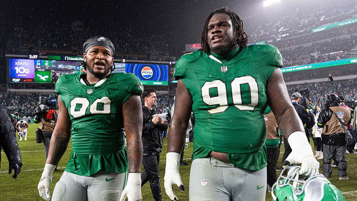 Philadelphia Eagles defensive tackle Jordan Davis (90) and defensive tackle Jalen Carter (98) walk off the field after a victory against the Buffalo Bills at Lincoln Financial Field.