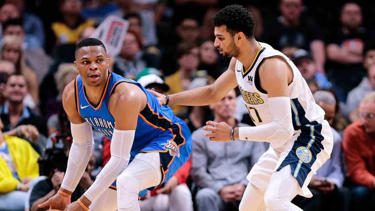 Denver Nuggets guard Jamal Murray (27) guards Oklahoma City Thunder guard Russell Westbrook (0) in the second quarter at the Pepsi Center. 