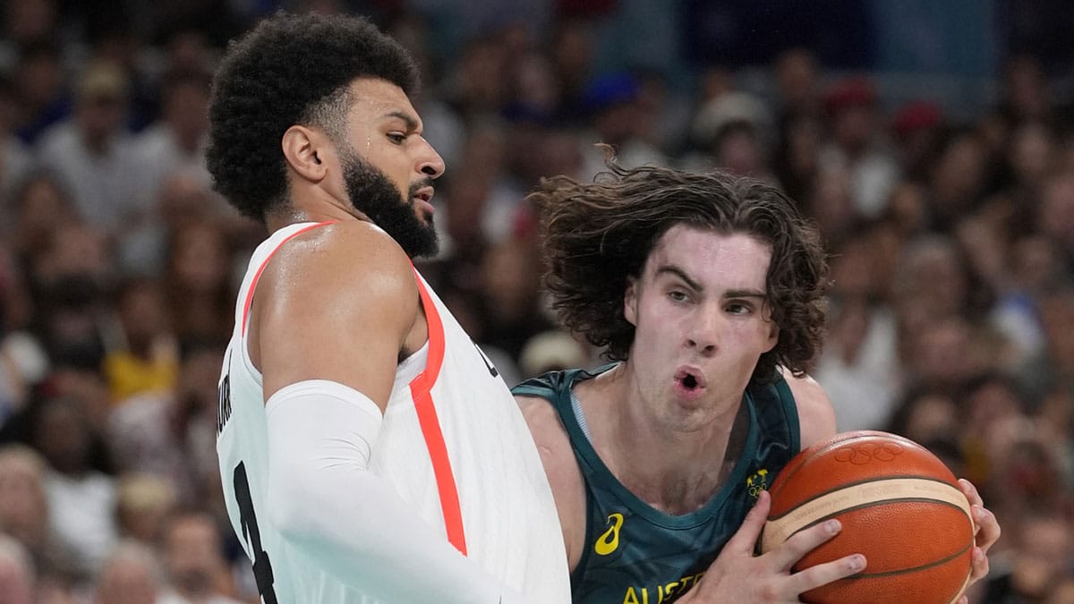 Jul 30, 2024; Villeneuve-d'Ascq, France; Australia guard Josh Giddey (3) drives against Canada guard Jamal Murray (4) in a men's group stage basketball match during the Paris 2024 Olympic Summer Games at Stade Pierre-Mauroy. Mandatory Credit: John David Mercer-USA TODAY Sports