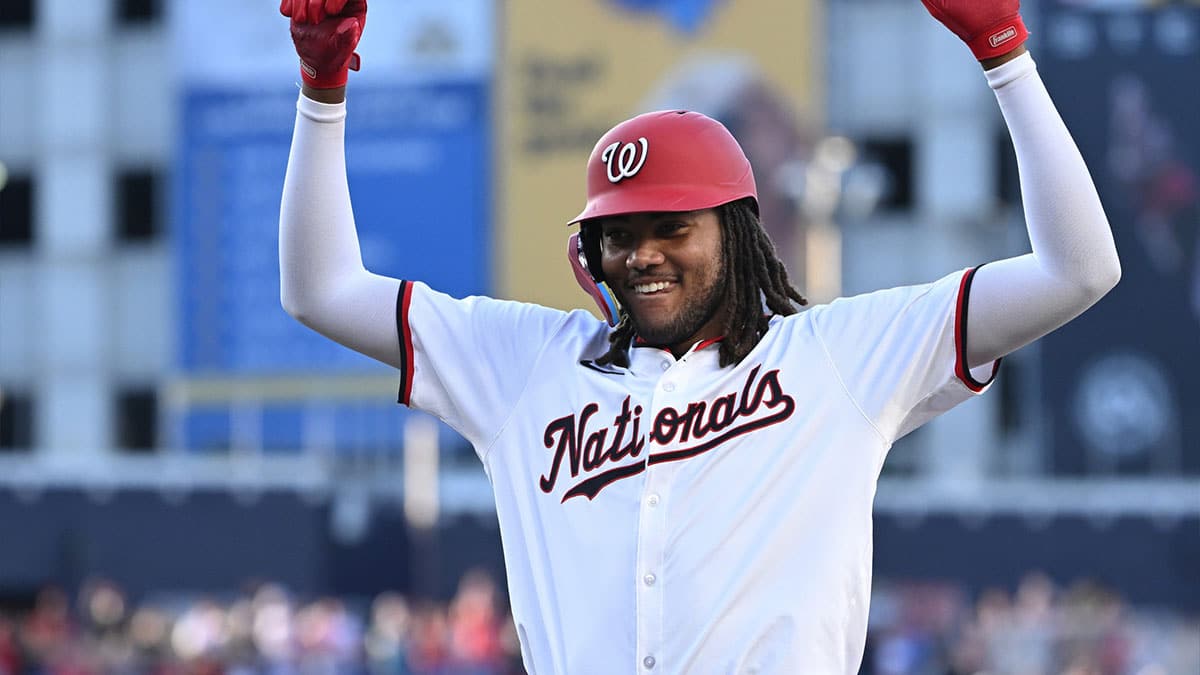 Washington Nationals center fielder James Wood (50) celebrates on first base after a base hit during his first Major League at bat against the New York Mets during the second inning at Nationals Park.