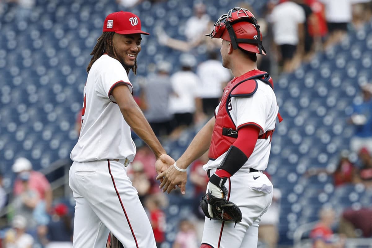 Washington, District of Columbia, USA; Washington Nationals outfielder James Wood (29) celebrates with Washington Nationals catcher Riley Adams (15) after their game against the Cincinnati Reds at Nationals Park.