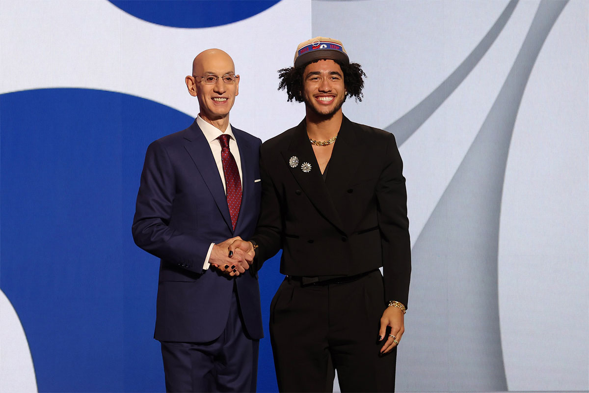 Jared McCain poses for photos with NBA commissioner Adam Silver after being selected in the first round by the Philadelphia 76ers in the 2024 NBA Draft at Barclays Center.