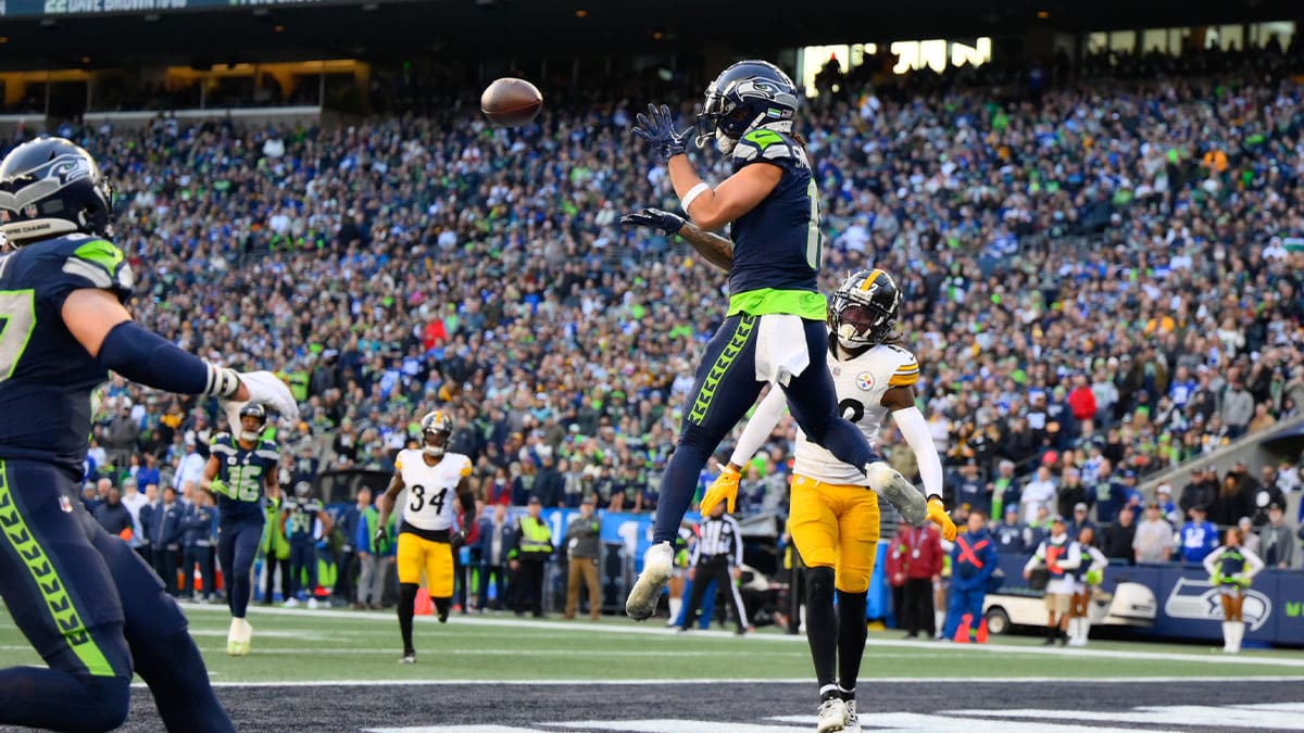 Dec 31, 2023; Seattle, Washington, USA; Seattle Seahawks wide receiver Jaxon Smith-Njigba (11) catches a pass for a touchdown against the Pittsburgh Steelers during the first half at Lumen Field.