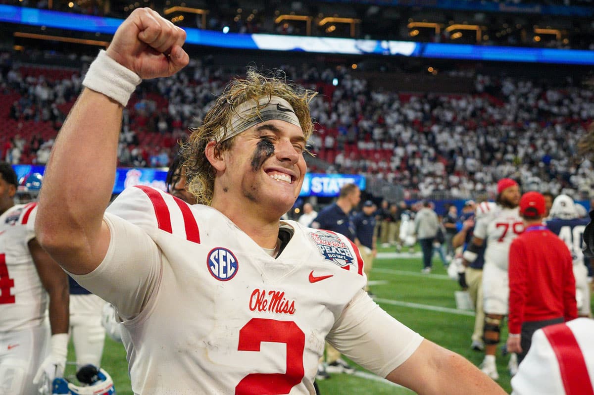 Mississippi Rebels quarterback Jaxson Dart (2) celebrates after a victory against the Penn State Nittany Lions in the Peach Bowl at Mercedes-Benz Stadium.
