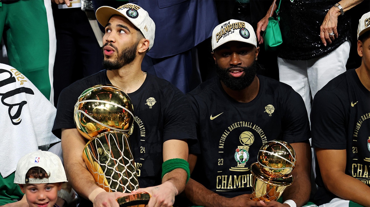 Boston Celtics forward Jayson Tatum (0) and guard Jaylen Brown (7) celebrates with the Larry O’Brian Trophy after beating the Dallas Mavericks in game five of the 2024 NBA Finals to win the NBA Championship at TD Garden.