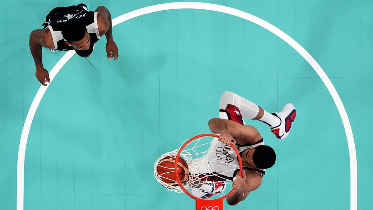 United States small forward Jayson Tatum (10) dunks against South Sudan guard Carlik Jones (4) in the third quarter during the Paris 2024 Olympic Summer Games at Stade Pierre-Mauroy