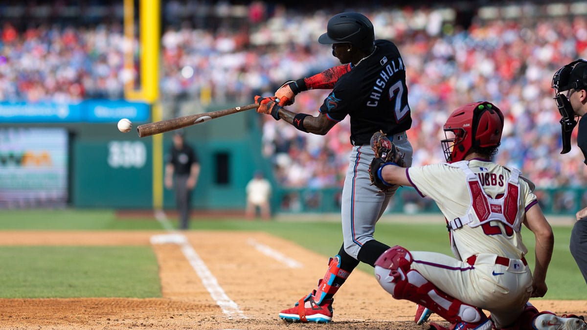 Jun 29, 2024; Philadelphia, Pennsylvania, USA; Miami Marlins outfielder Jazz Chisholm Jr. (2) hits an RBI single during the seventh inning against the Philadelphia Phillies at Citizens Bank Park.