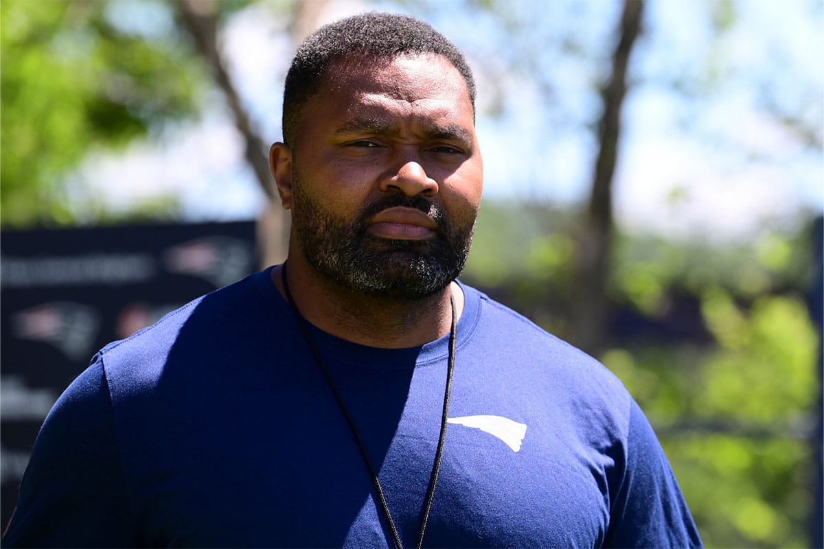 New England Patriots head coach Jerod Mayo walks to a press conference before minicamp at Gillette Stadium.