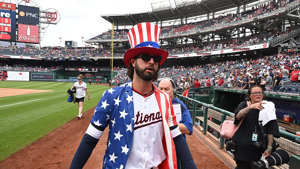 Washington Nationals left fielder Jesse Winker (6) walks back to the dugout while wearing a patriotic themed top hat after the game against the New York Mets at Nationals Park