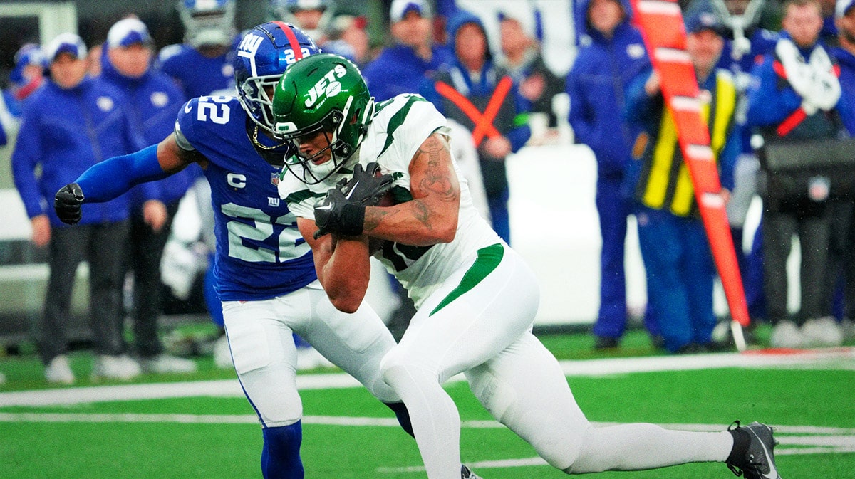 New York Jets wide receiver Allen Lazard (10) runs with the ball before being stopped by New York Giants cornerback Adoree' Jackson (22) in the fourth quarter.