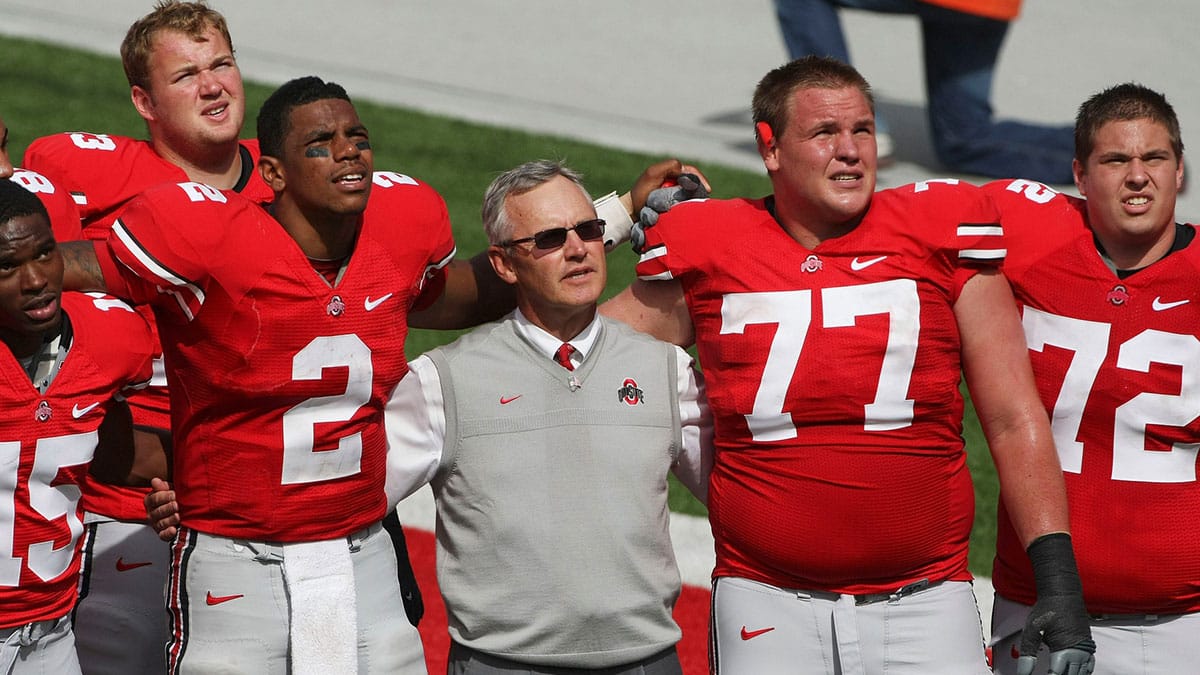 Ohio State football coach Jim Tressel, Ohio State quarterback Terrelle Pryor (2), Ohio State offensive linesman Connor Smith (77) and Ohio State offensive linesman Scott Sika (72) sing Carmen Ohio after beating Ohio University during the second half of their NCAA football game