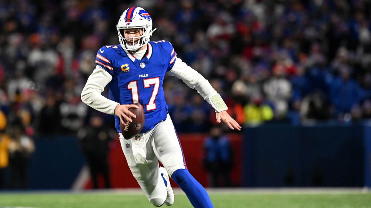 Buffalo Bills quarterback Josh Allen (17) rushes the ball against the Kansas City Chiefs in the first half of the 2024 AFC divisional round game at Highmark Stadium. 