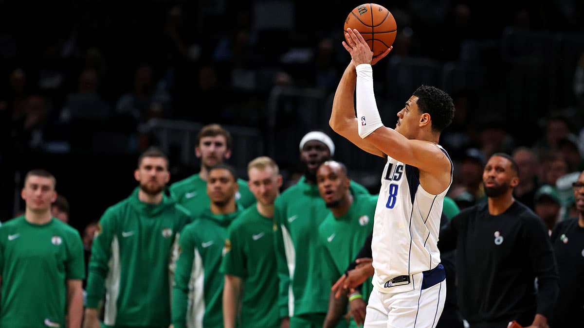 Dallas Mavericks guard Josh Green (8) shoots the ball against the Boston Celtics in game five of the 2024 NBA Finals at TD Garden.