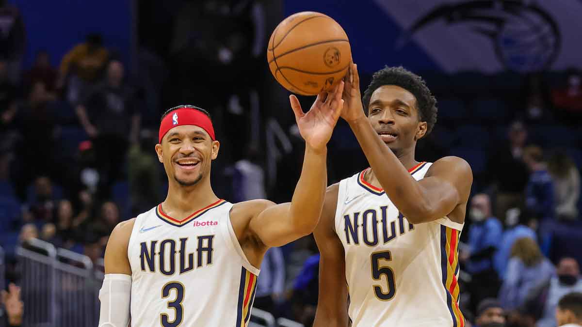 New Orleans Pelicans guard Josh Hart (3) and forward Herbert Jones (5) celebrate their win against the Orlando Magic at Amway Center.