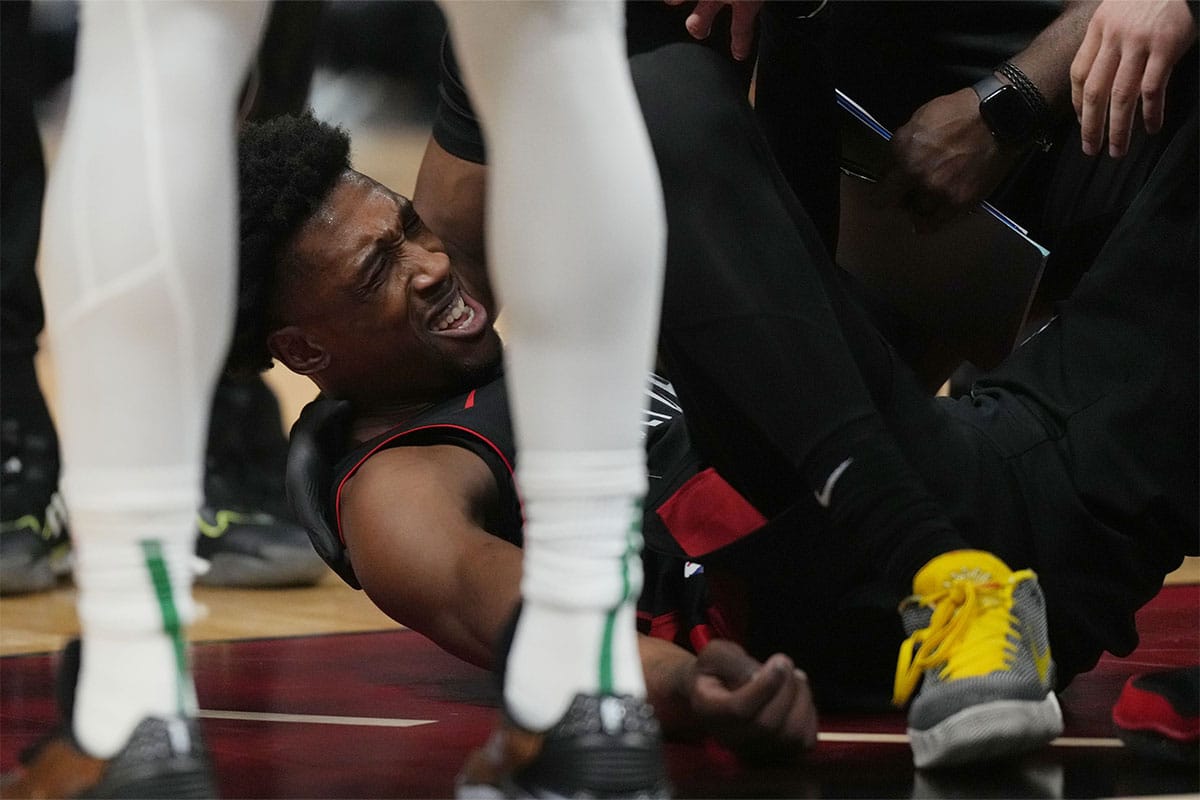 Miami Heat guard Josh Richardson (0) goes down with an injury during the first half at Kaseya Center against the Boston Celtics. 