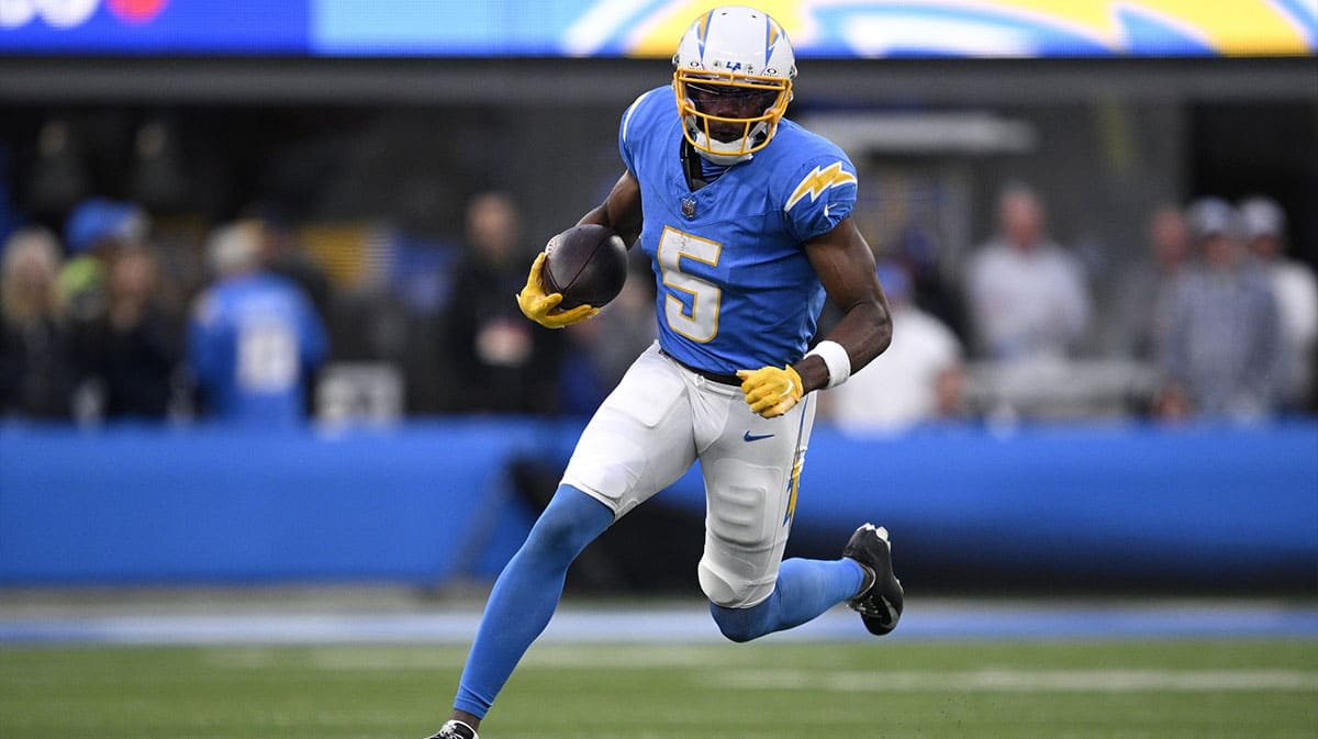 Jan 7, 2024; Inglewood, California, USA; Los Angeles Chargers wide receiver Joshua Palmer (5) runs with the ball during the second half against the Kansas City Chiefs at SoFi Stadium.