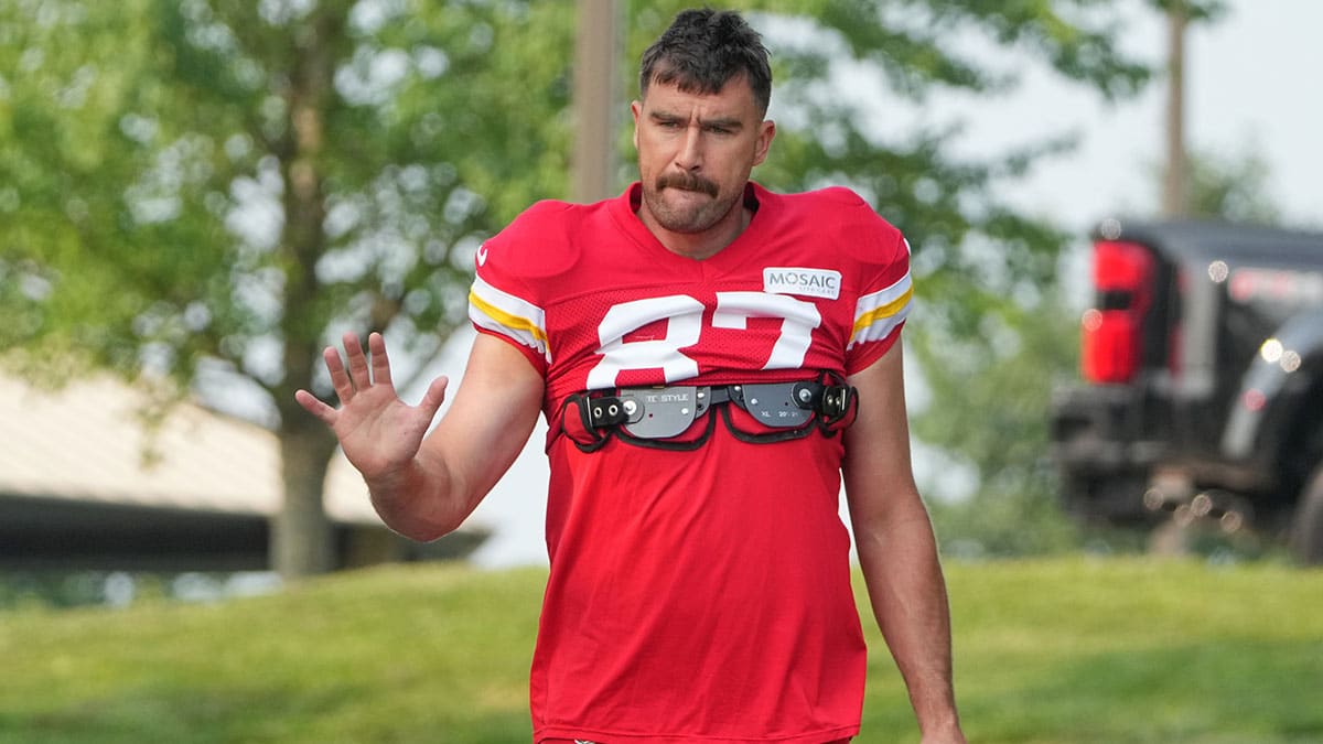 Kansas City Chiefs tight end Travis Kelce (87) waves to fans as he walks down the hill from the locker room to the fields prior to training camp at Missouri Western State University. 