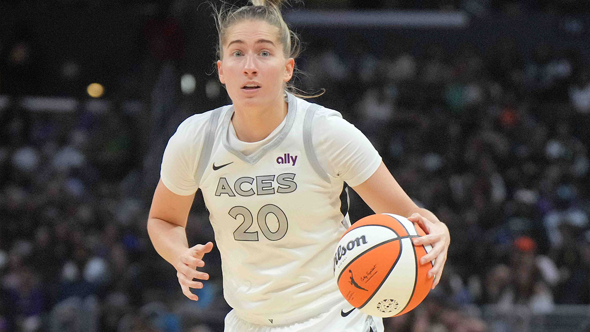 Las Vegas Aces guard Kate Martin (20) dribbles the ball against the LA Sparks in the second half at Crypto.com Arena.
