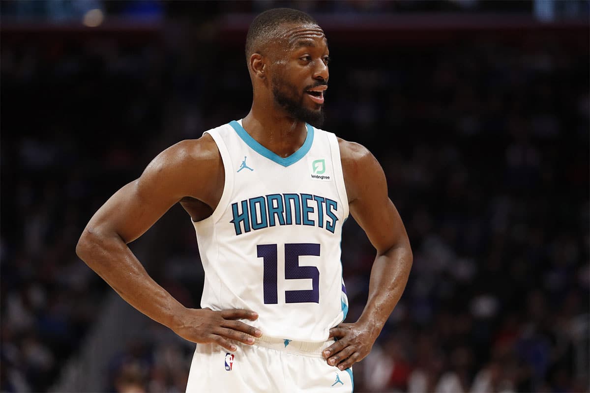Charlotte Hornets guard Kemba Walker (15) talks to his bench during the fourth quarter against the Detroit Pistons at Little Caesars Arena.