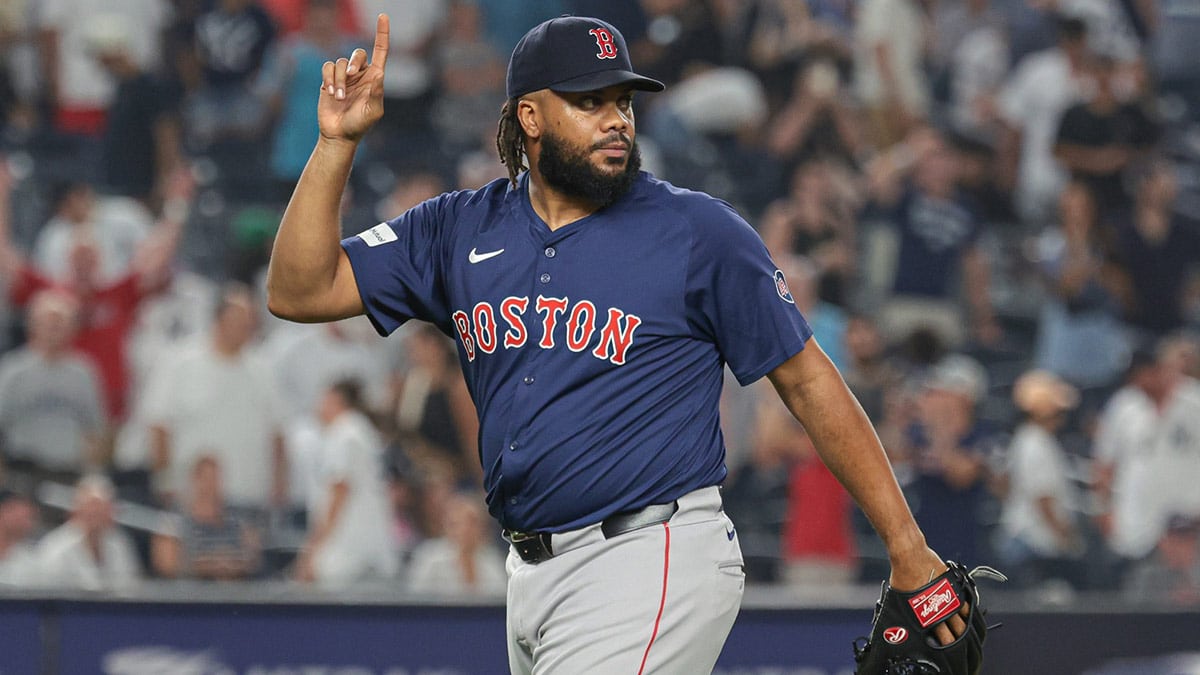 Boston Red Sox relief pitcher Kenley Jansen (74) celebrates after closing the game against the New York Yankees at Yankee Stadium.