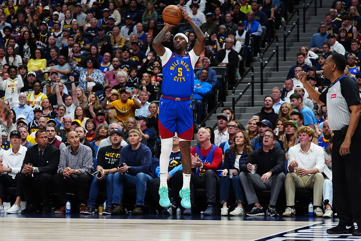 Denver Nuggets guard Kentavious Caldwell-Pope (5) shoots the ball in the second half against the Minnesota Timberwolves during game one of the second round for the 2024 NBA playoffs at Ball Arena.