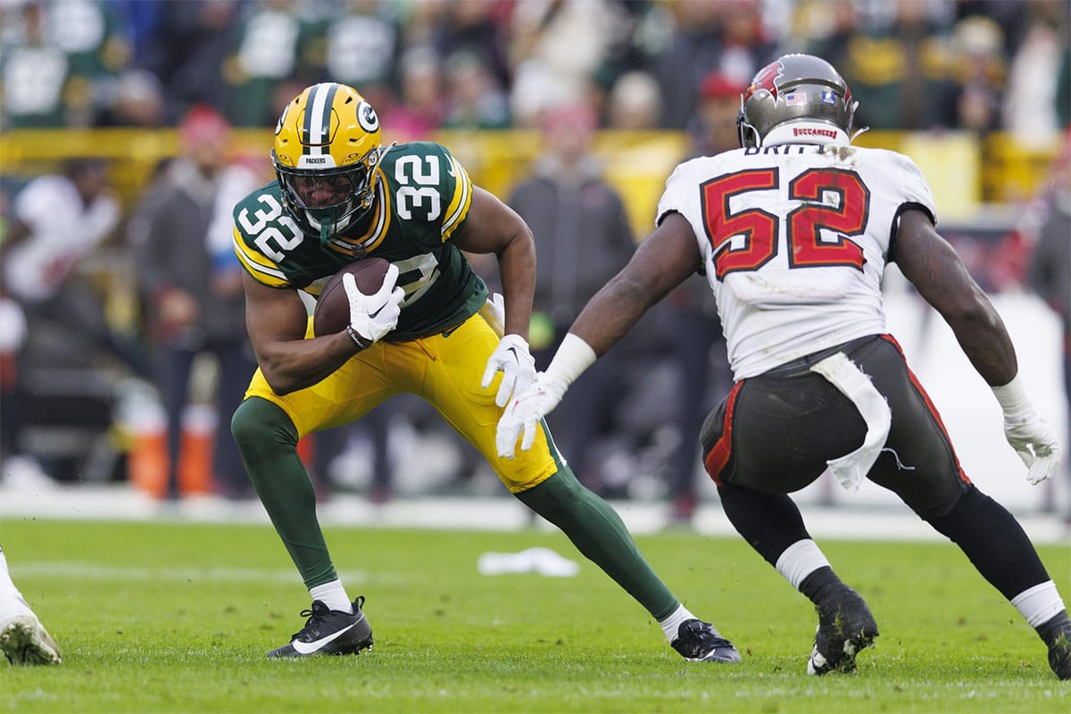 Green Bay Packers running back Kenyan Drake (32) rushes with the football as jTampa Bay Buccaneers linebacker K.J. Britt (52) defends during the second quarter at Lambeau Field.