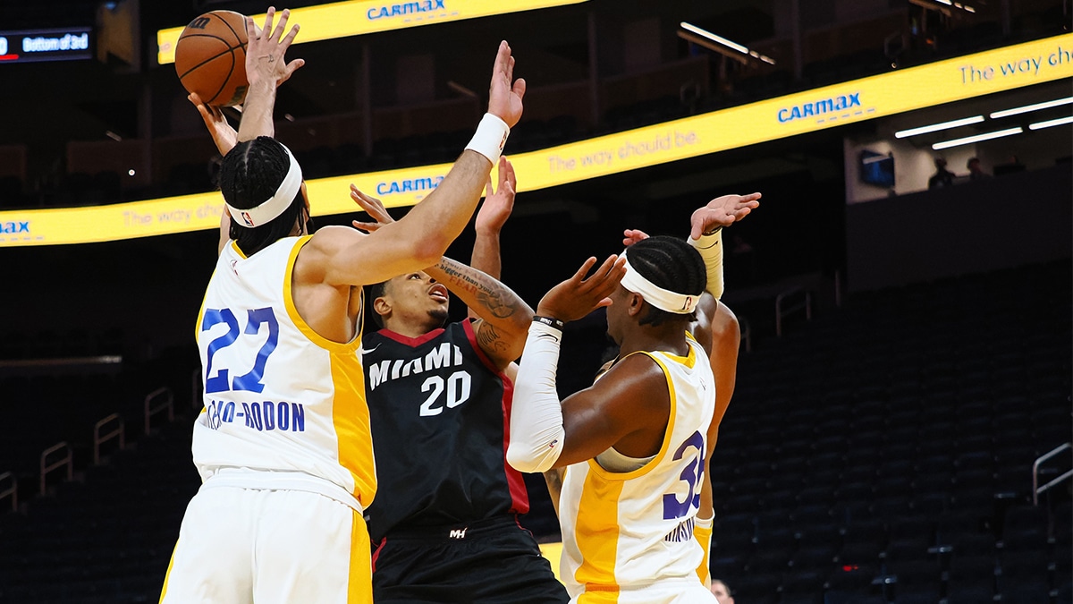 Miami Heat forward Keshad Johnson (20) shoots the ball between Los Angeles Lakers forward/guard Vincent Valerio-Bodon (27) and forward Blake Hinson (36) during the second quarter at Chase Center.