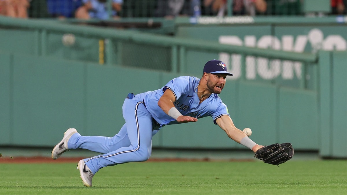 Jun 24, 2024; Boston, Massachusetts, USA; Toronto Blue Jays center fielder Kevin Kiermaier (39) attempts to catch a fly ball during the eighth inning against the Boston Red Sox at Fenway Park. 