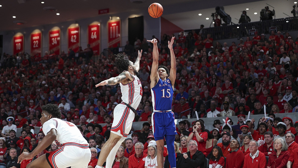 Kansas Jayhawks guard Kevin McCullar Jr. (15) shoots the ball as Houston Cougars guard Emanuel Sharp (21) defends during the first half at Fertitta Center.