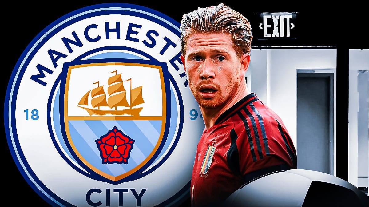 Kevin de Bruyne in front of the Manchester City logo and an exit door next to it