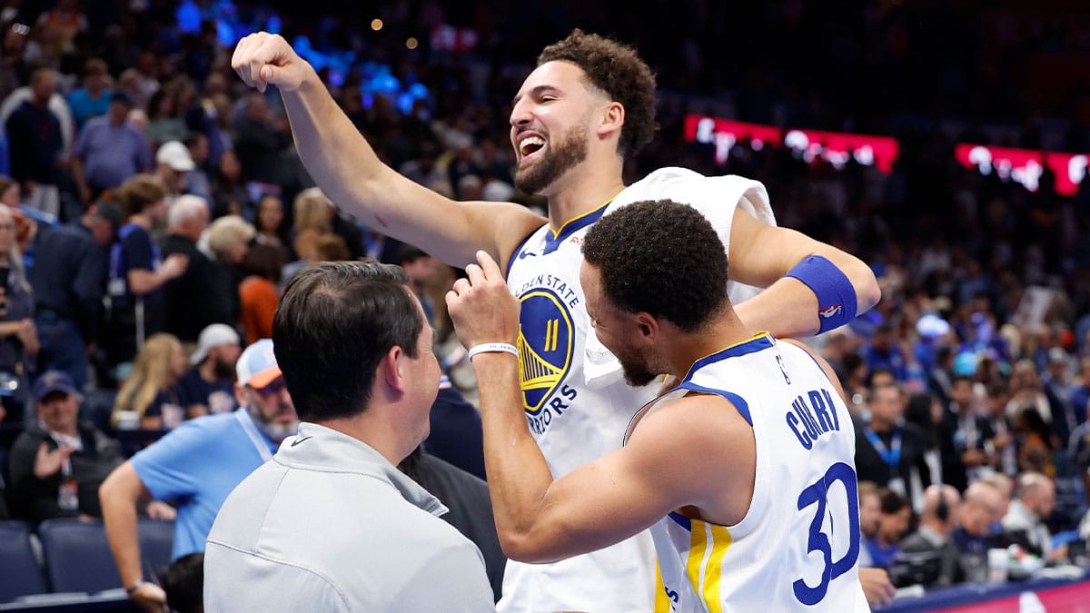 Golden State Warriors guard Klay Thompson (11) and guard Stephen Curry (30) celebrate after defeating the Oklahoma City Thunder at Paycom Center. Golden State won 141-139