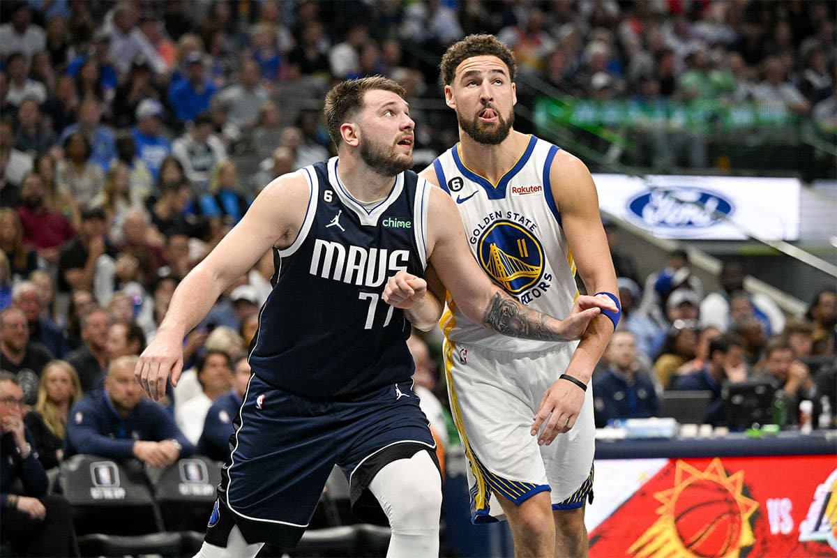 Dallas Mavericks guard Luka Doncic (77) and Golden State Warriors guard Klay Thompson (11) in action during the game between the Dallas Mavericks and the Golden State Warriors at the American Airlines Center. 