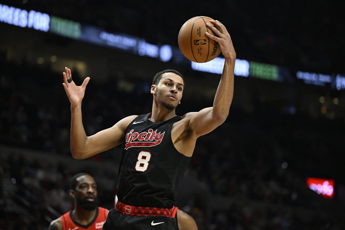 Portland Trail Blazers forward Kris Murray (8) grabs a rebound during the second half against the Houston Rockets at Moda Center.