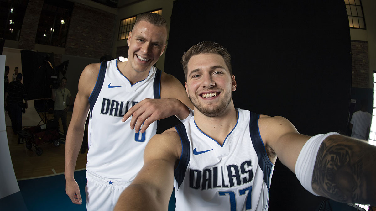 Dallas Mavericks forward Luka Doncic (right) and forward Kristaps Porzingis (left) pose for a selfie photo during the Dallas Mavericks media day at the American Airlines Arena.