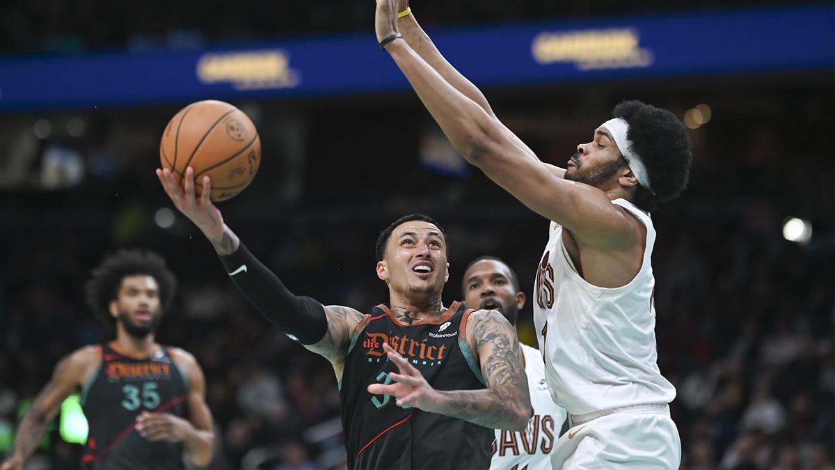 Washington Wizards forward Kyle Kuzma (33) shoots as Cleveland Cavaliers center Jarrett Allen (31) defends during the second half at Capital One Arena.