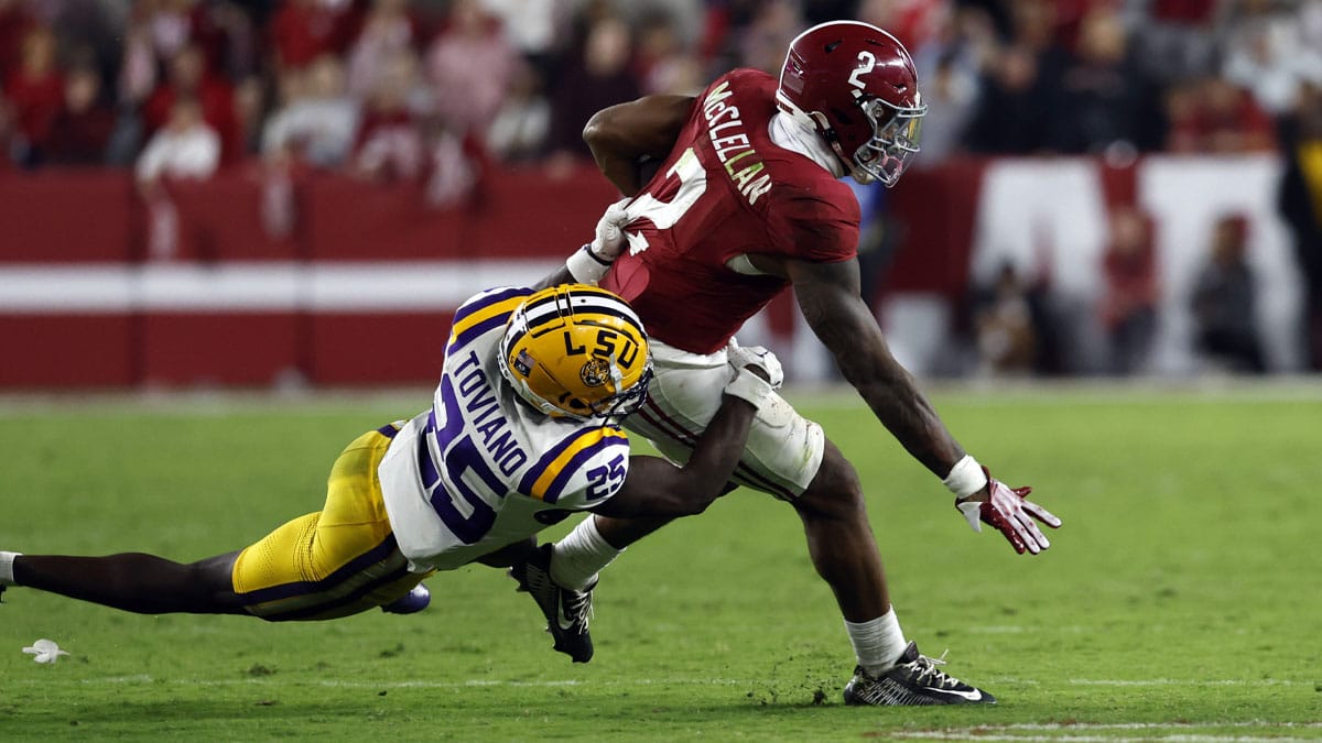 Alabama Crimson Tide running back Jase McClellan (2) is tackled by LSU Tigers safety Javien Toviano (25) as he carries the ball during the second half at Bryant-Denny Stadium.