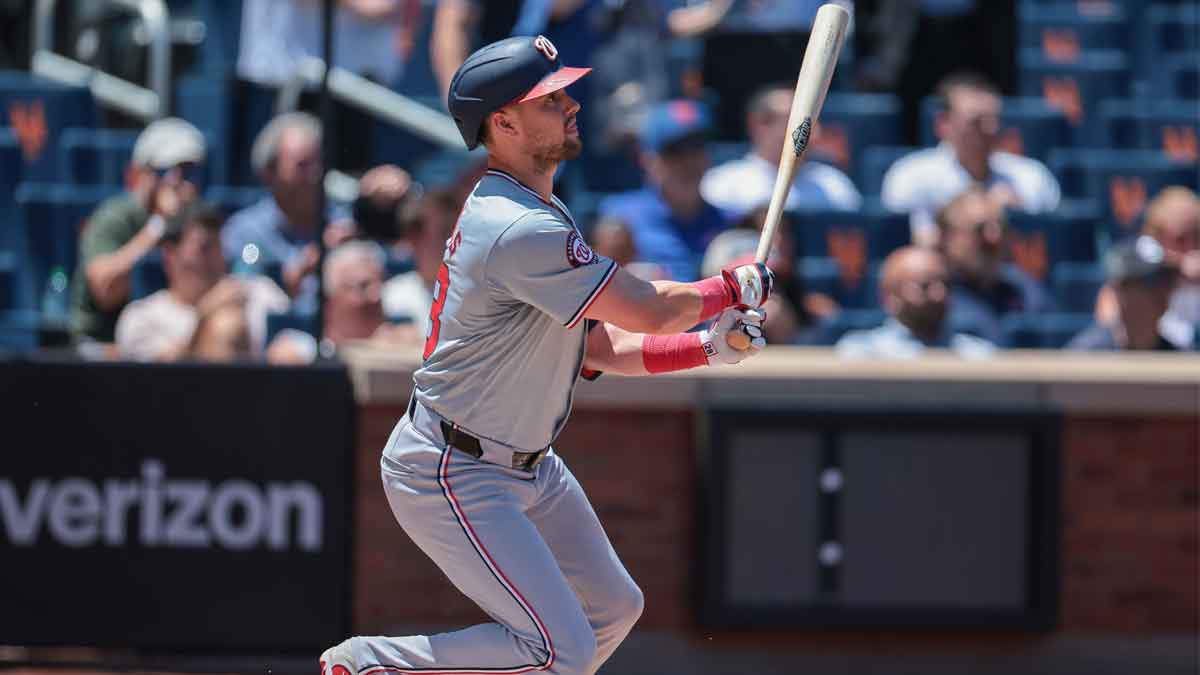 Washington Nationals right fielder Lane Thomas (28) singles during the first inning against the New York Mets at Citi Field.