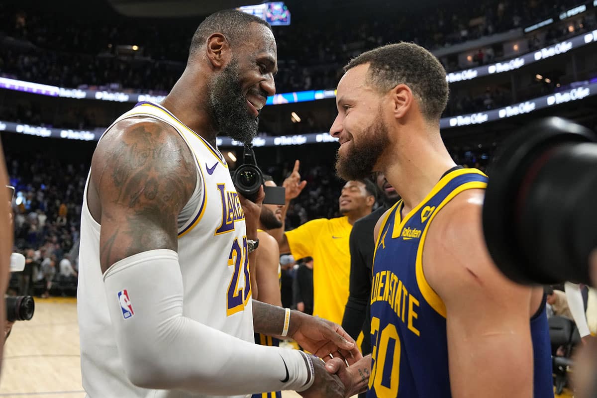 Los Angeles Lakers forward LeBron James (left) and Golden State Warriors guard Stephen Curry (right) greet each other after the game at Chase Center.